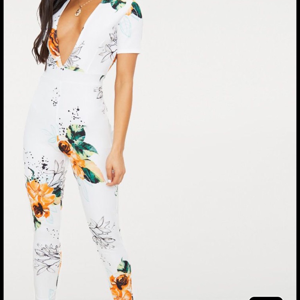White floral one piece. Never worn! !SOLD!